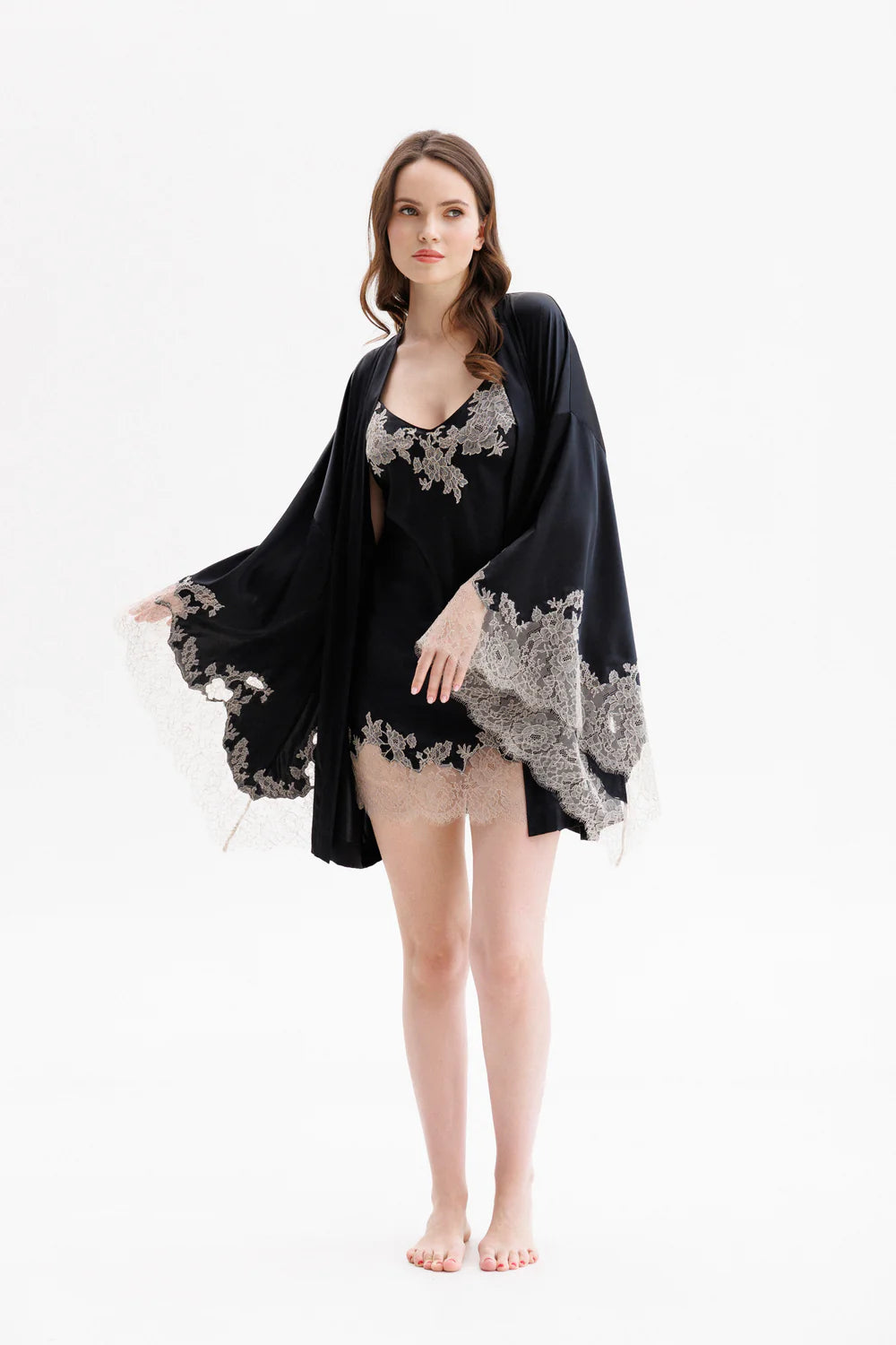 Woman wearing a black silk lace nightgown (sold separately)  with a matching robe. Showing the full front look. 